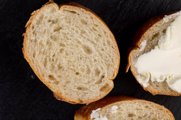 fresh soft cheese made from cow's milk spread on wheat bread