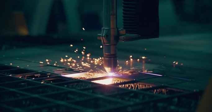 Plasma laser cutting metal sheet with sparks Welding