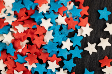 small star shaped confectionery decorations, close up