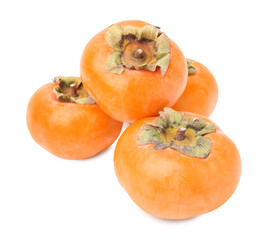 Whole delicious juicy persimmons on white background