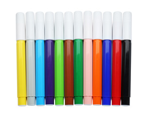 Many different colorful markers on white background, top view