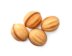 Delicious nut shaped cookies with condensed milk on white background, top view