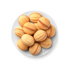 Plate of delicious nut shaped cookies with condensed milk on white background, top view