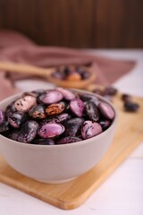 Bowl with dry kidney beans on white table