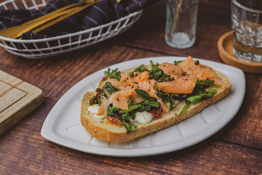 smoked salmon toast with sourdough and cheese. healthy mediterranean eating and diet.