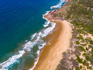 aerial view of beautiful beaches and cliffs at agnes water coast near the town of 1770 in gladstone region, queensland, australia; pristine beaches and unique sandy bays