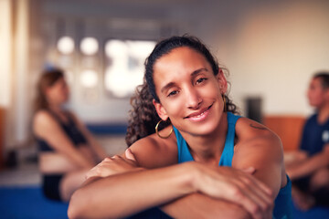 portrait beautiful mid adult latina cheerful sporty woman in gym interior