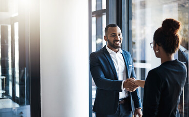 Hand shake, man and woman in hallway for welcome, b2b collaboration or business meeting with respect. Businessman, partnership and shaking hands for human resources, hiring or greeting in workplace