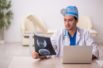 Young male doctor radiologist working in the clinic