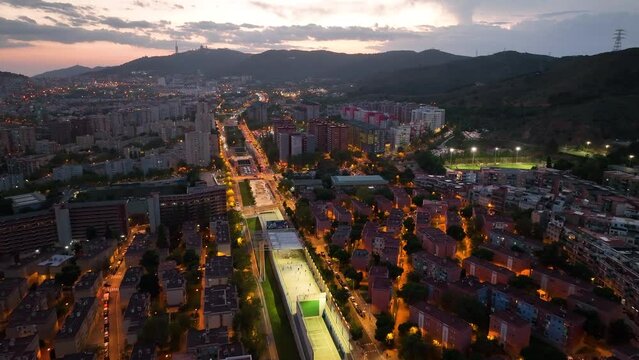 Aerial view of Barcelona city skyline at night, Streets with busy car traffic and city lights. Nou Barris District and Ronda de dalt, Catalonia, Spain