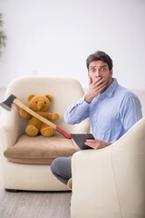 Young male psychologist meeting with toy bear