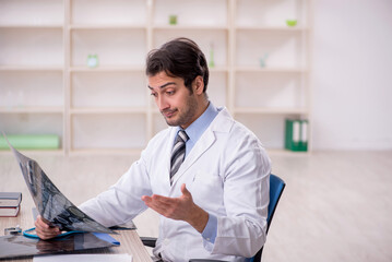 Young male doctor radiologist working in the clinic