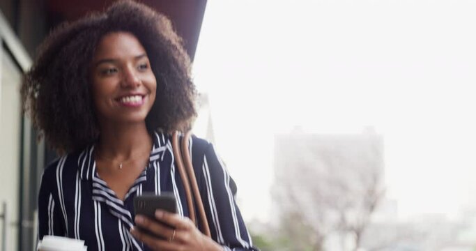 Commute, coffee and phone with a business woman in the city during the day for a morning walk. Smile, drink and text message with a happy young black female employee walking alone in an urban town