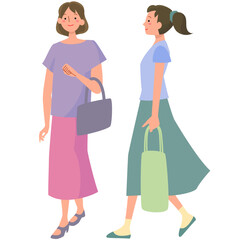 夏のファッションで歩く女性たち