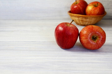 red apple fruit isolated on gray wooden background,selective focus with copy space
