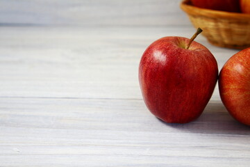 red apple fruit isolated on gray wooden background,selective focus with copy space
