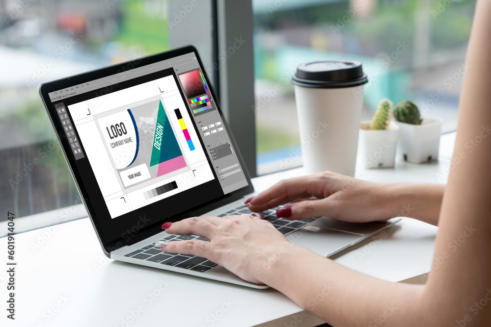 Poster graphic designer software for modern design of web page and commercial ads showing on the computer s