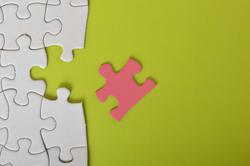 The jigsaw puzzle with a missing piece is a metaphor for the challenges we face in business. We may...