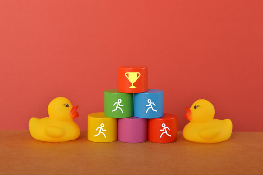 Toy duck heading to the target. Concept of business as competition