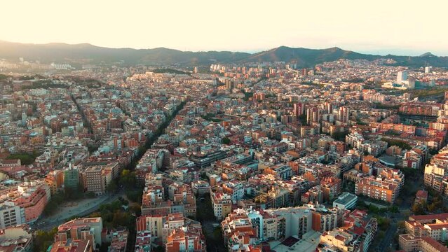 Barcelona city skyline at sunset, aerial view of Guinardo and La Font d'en Fargues, Catalonia, Spain