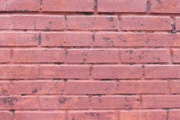 Brick building painted with red color as background