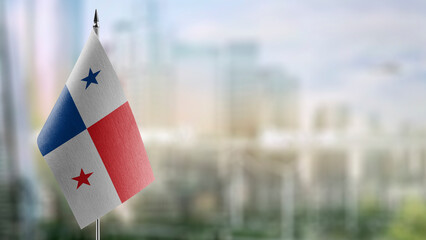 Small flags of the Panama on an abstract blurry background