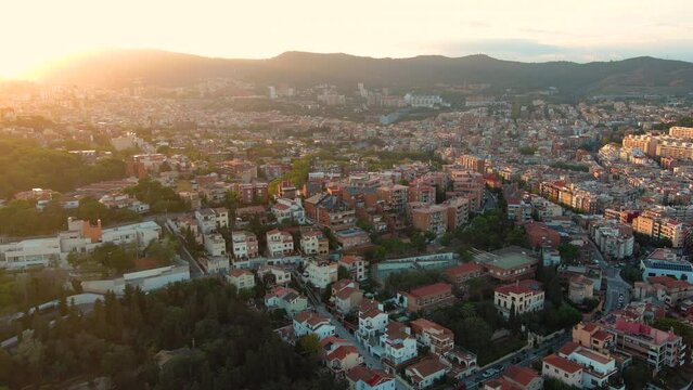 Barcelona city skyline at sunset, aerial view of Guinardo and La Font d'en Fargues, Catalonia, Spain