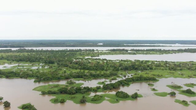 Aerial view over Amazon river wetlands and vegetation, in cloudy Parintins, Brazil