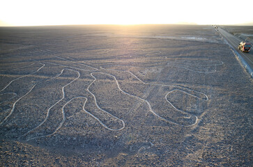 Amazing massive ancient geoglyphs of Nazca lines called Arbol (tree) in the evening sunlight, view...