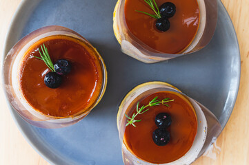 Top view of round Caramel custard cake on a wooden table, Custard chiffon cake, sweet and moist dessert. Sliced a piece of cake. Top view, Dessert, Obesity, bite of cake.
