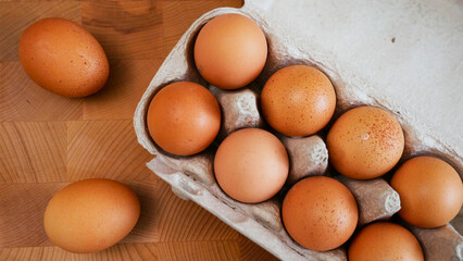 eggs in box on a wooden board	