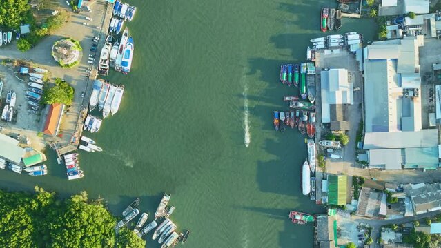 Aerial View Hyperlapse, Amazing top view sailing boats and fishing boats other watercraft in the harbor at Phuket Thailand