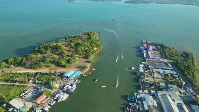 Aerial View Hyperlapse, Amazing top view sailing boats and fishing boats other watercraft in the harbor at Phuket Thailand