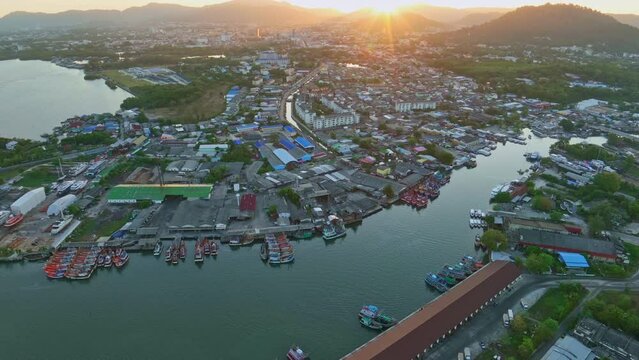Aerial View Hyperlapse, Amazing top view sailing boats and fishing boats other watercraft in the harbor at Phuket Thailand