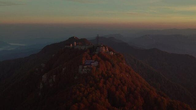 Sunrise vivid colorful aerial of a Sanctuary on the summit of a mountain Italy Sanctuary of Our Lady 'del Monte Sacro'