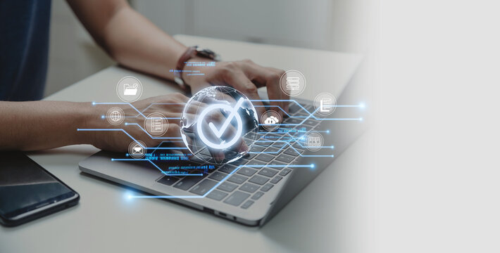 Businessman using laptop with document and mark correct for online approve paperless and business process automation concept.