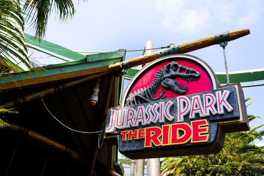 Japan - April 03, 2023: T Rex and Jurassic Park The Ride logo sign entrance for playing adventure theme in Universal Studios Japan, Osaka