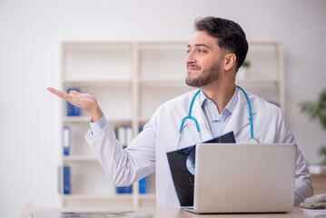 Young male doctor radiologist working in the clinic