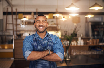Coffee shop, waiter and portrait of African man in restaurant for service, working and crossed arms...