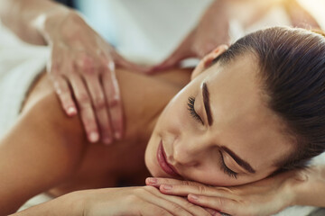 Relax, detox and massage with woman in spa for wellness, luxury and cosmetics treatment. Skincare, peace and zen with female customer and hands of therapist for physical therapy, salon and beauty