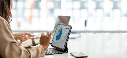 Business people team working at office with tablet and document, doing planning analyzing the...
