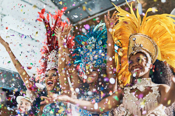 Happy woman, samba dance and confetti in celebration for party, event or festival at carnival. Women dancer in rio for traditional dancing, music or festive band performance in happiness together