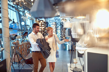 Couple Choosing Lamps for Their Home Interior