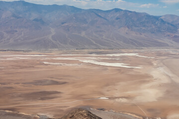 Scenic view of Salt Badwater Basin and Panamint Mountains seen from Dante View in Death Valley National Park, California, USA. Coffin Peak, along crest of Black Mountains, overlooking desert landscape