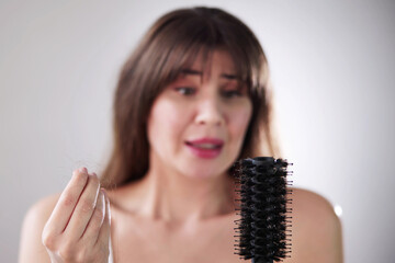 Hairfall And Hairloss. Worried Woman