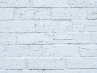 Close up. Brick wall and white surface, clean, rough, uneven surface material. Retro decoration construction