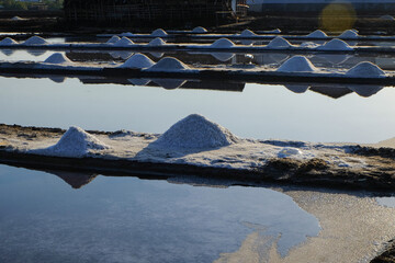 The process of crystallization of sea water into salt in the traditional way in Indonesia.