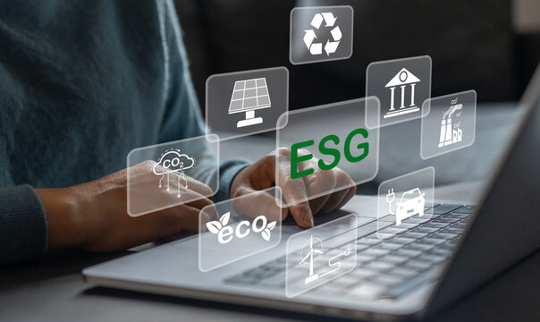 People use laptop with ESG icon of saving clean energy environmental, social, governance, sustainable and corporation development, green eco friendly, environment, go green, CO2, ESG concept