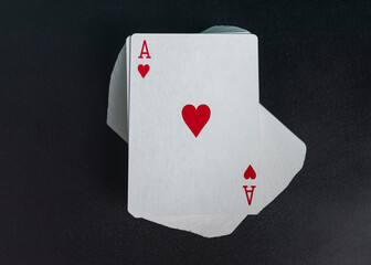 deck of playing cards with ace love on the top on black background