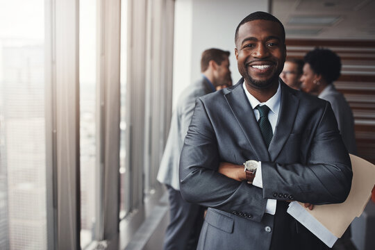Black man in business, arms crossed with smile in portrait and leadership, corporate lawyer in meeting. Businessman in conference room, happy male person with confidence in company and management